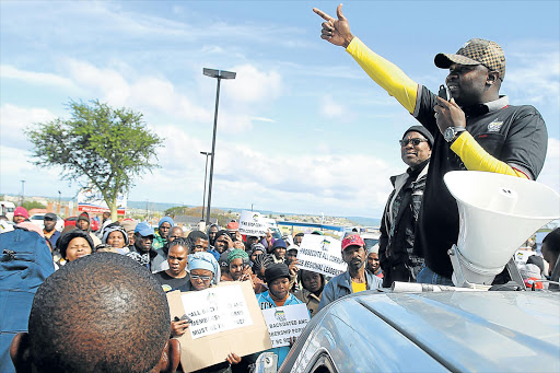 LISTEN UP: Former provincial ANC youth league chairman Ayanda Matiti addressing the crowd that marched to Mdantsane FNB branch to hand over a memorandum Picture: SIBONGILE NGALWA