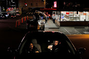 People eat dinner in their car at Dick’s Drive-In as restaurants and bars are limited to take out and delivery service only amid the coronavirus outbreak in Seattle, Washington, US, on March 17 2020. 