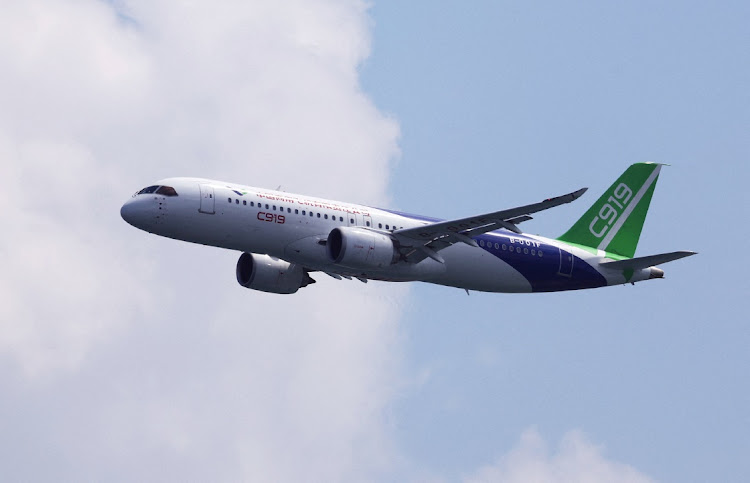 A Comac C919 flies past during an aerial flying display ahead of the Singapore Airshow at Changi Exhibition Centre in Singapore, on February 18, 2024. Picture: REUTERS/EDGAR SU