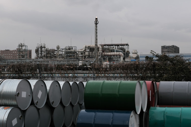 Oil drums are shown near industrial plants and manufacturing facilities in the Keihin industrial area in Kawasaki, Kanagawa Prefecture, Japan. File photo: BLOOMBERG/SOICHIRO KORIYAMA