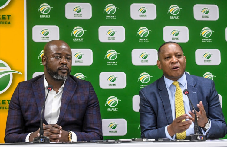 Cricket South Africa chief executive Thabang Moroe (L) and SABC chief operating officer Chris Maroleng (R) addresses the media in Johannesburg on September 26, 2018.