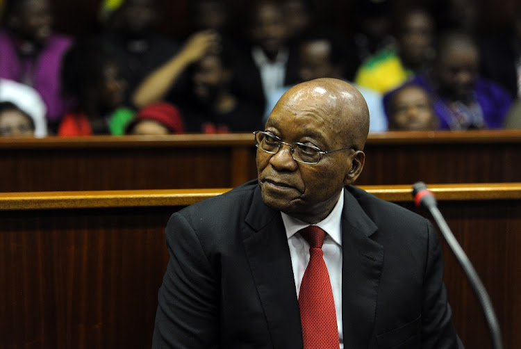 Former President Jacob Zuma sits in the dock during his brief appearance at the Durban High Court.