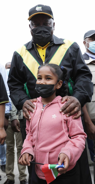 President Cyril Ramaphosa meets eight-year-old Layla-Ann Piston during campaigning on Thursday.