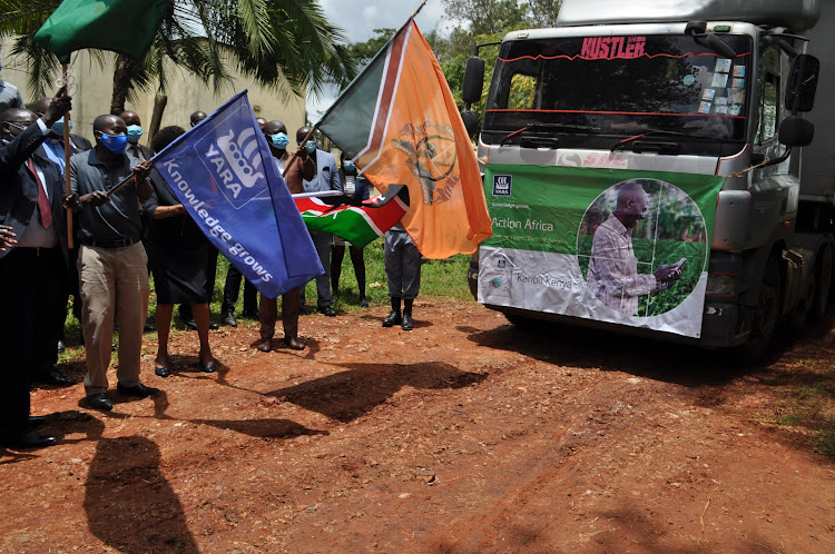 Trans Nzoia Deputy Governor Stanley Tarus and Yara East Africa's senior Commercial manager Vitalis Wafula flag off a truck transporting fertiliser for 25 wards in Trans Nzoia county.