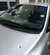 At least 12 bullet holes were visible in the car in which Rashied Staggie was attacked in Salt River on December 13 2019.