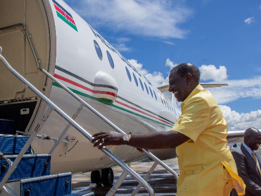 President William Ruto boards a plane.