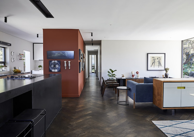 When walking down the passage you can see greenery through a narrow vertical window in the master bedroom.