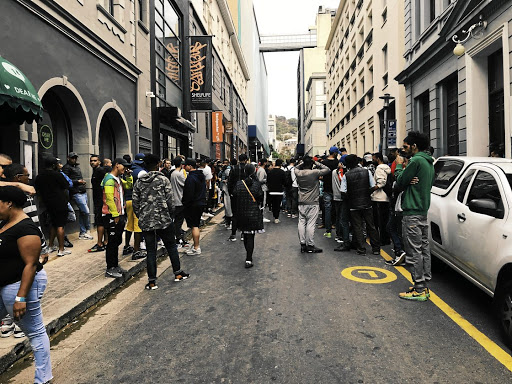 Early on a Saturday in downtown Cape Town, sneaker buyers gather. Among them could be scores of people hired to stack the odds during the lottery-style shoe sale.
