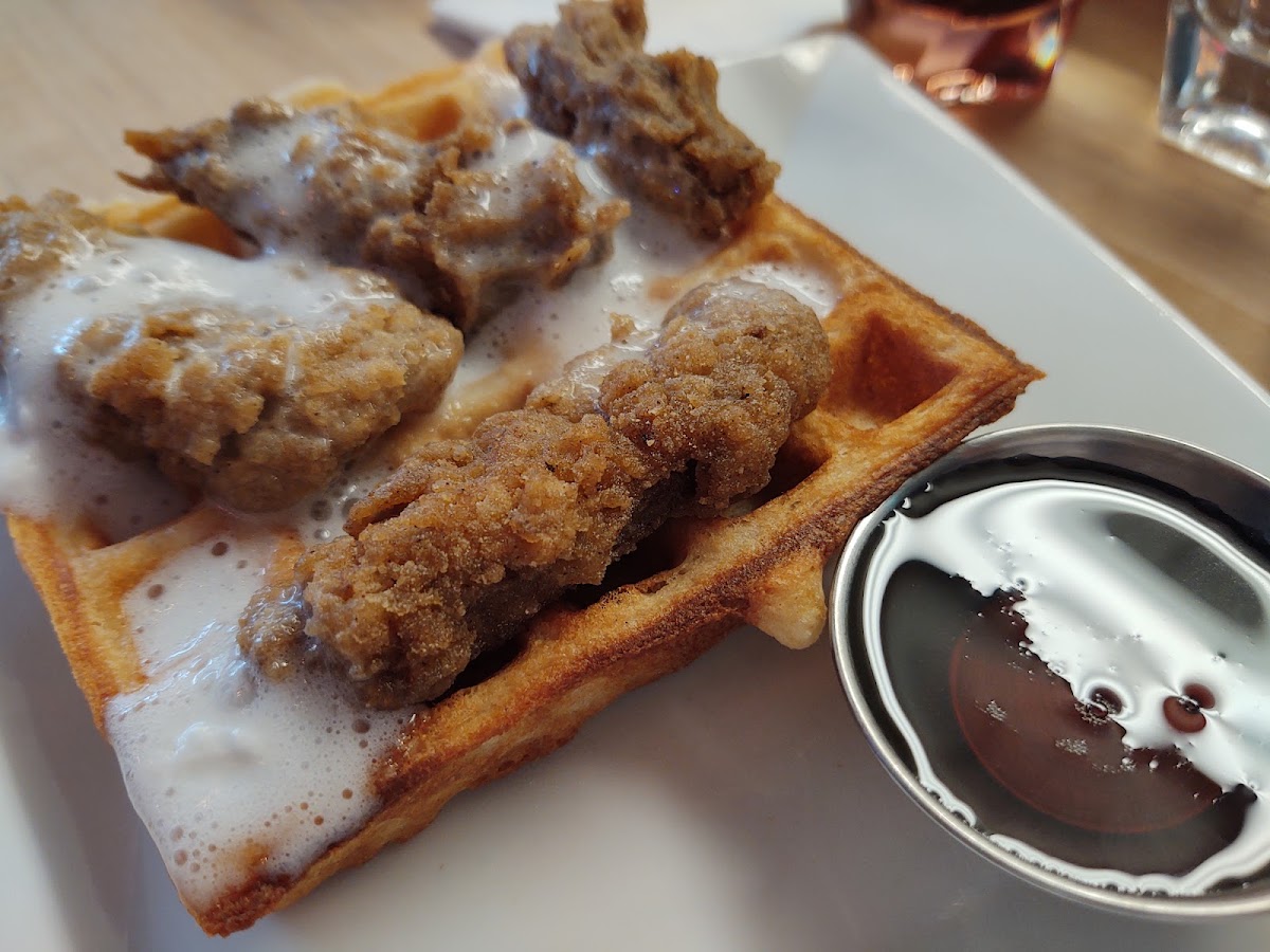 Vegan, gf waffle with vegan gf lion's mane chickUn, vegan gf whip and pure maple syrup. $14. Not cheap but  the waffle was so light and fluffy inside and crispy outside.