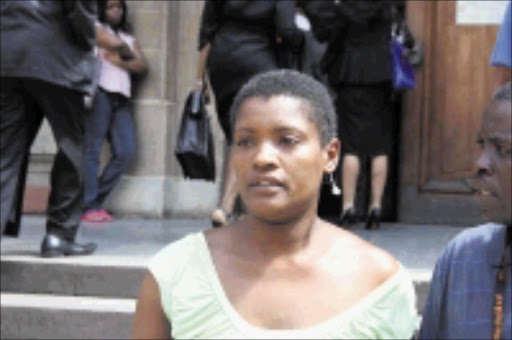 ROUSER: This woman caused the court to be adjourned when she disrupted Jackie Selebi's corruption trial by asking to see Selebi's lawyer. Pic: Munyadziwa Nemutudi. 10/11/2009. © Sowetan.