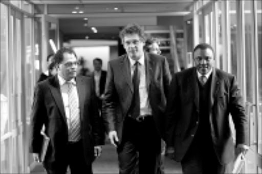TOP GUNS: 2010 LOC chief executive officer Danny Jordaan, Fifa general secretary Jerome Valcke and LOC chairman Irvin Khoza after a 2010 World Cup Organising Committee press conference at Safa House yesterday. Pic. Veli Nhlapo. 08/07/08. © Sowetan.