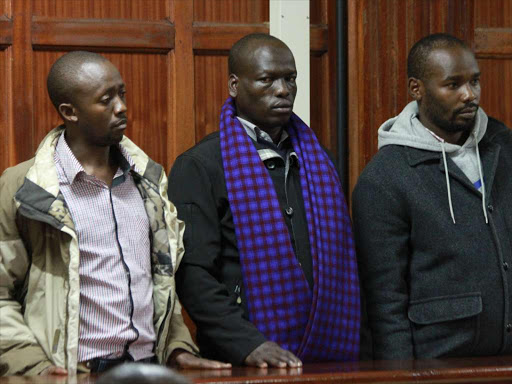 Police officers Simon Gitonga, Zachariah Kandie and Eric Mosoti at the Milimani law courts yesterday /PHILIP KAMAKYA