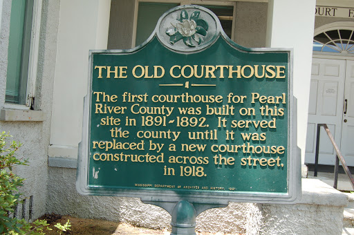The first courthouse for Pearl River County was built on this site in 1891-1892. It served the county until it was replaced by a new courthouse constructed across the street, in 1918