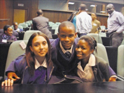 SHARP MINDS: Winner Charlotte de Fleur, left, from Worcester Secondary School in Western Cape, third place winner Kgaogelo Mokholwane from Steve Tshwete Secondary School in Gauteng, and second-placed Bojosi Morule from Eunice High School in the Free State. Pic. Unknown.