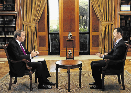 'CBS This Morning' co-host Charlie Rose, left, interviews Syrian President Bashar al-Assad at the Presidential Palace in Damascus this week