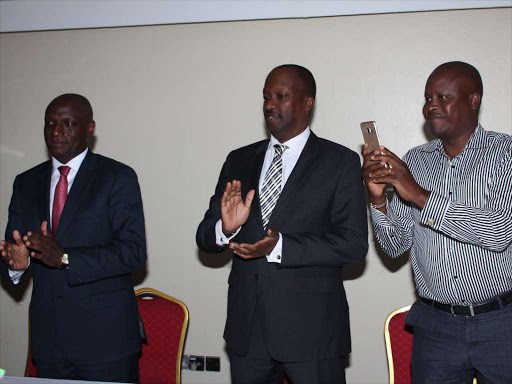 Energy CS Charles Keter, KNCCI chairman Kiprono Kittony and Kieni MP Kanini Kega at a function organised by USIU in Nairobi yesterday.
