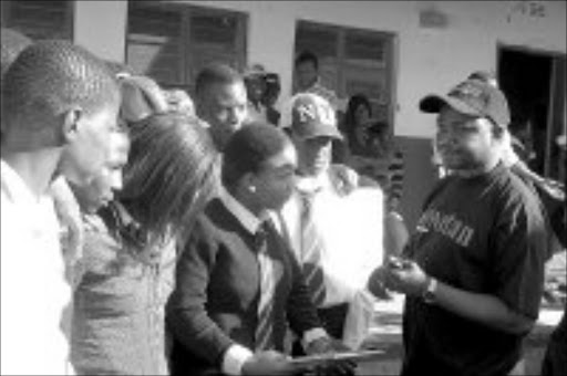 HUGE INTEREST: Sowetan's bureau chief in Limpopo, Frank Maponya, speaks to pupils at Mogoto in Zebediela, Limpopo, during a career guidance workshop and exhibition held at Reholegile High School on Friday. Education MEC Aaron Motsoaledi and other government officials also spoke to the pupils. Pic. Elijar Mushiana. 07/08/07. © Sowetan.