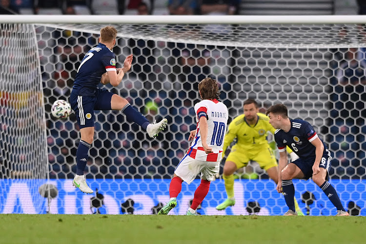 Croatia captain Luka Modric curls the ball with the outside of his boot to score a goal.