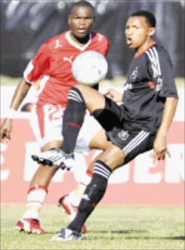 NO WAY: Bay United's Patrick Mayo keeps a close watch on Orlando Pirates' striker Excellent Walaza during their League match at EPRU Stadium in Port Elizabeth yesterday. Photo: Gallo Images. 28/09/08. © Gallo Images.