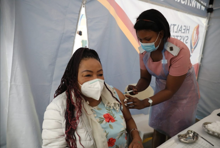 Primary school principal Nomusa Lushaba receives her Covid-19 vaccine.