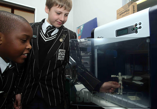 THINKING DIGITAL: Pupils at Selborne Primary School display the miniature skeleton produced by the school’s three-dimensional printer Picture: SIBONGILE NGALWA