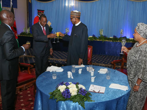 President Uhuru Kenyatta, Nigerian President Muhammadu Buhari, Deputy President William Ruto and First Lady Margaret Kenyatta during the State Banquet hosted in honour of the Nigerian President at State House, Nairobi. Photo/PSCU