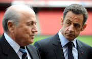A file photo of former France President Nicolas Sarkozy (R) talking with President of FIFA Sepp Blatter at the Emirates Stadium, in London, on March 27, 2008.