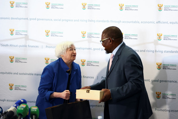 US treasury secretary Janet Yellen and finance minister Enoch Godongwana exchange gifts ahead of bilateral talks, at the Treasury offices in Pretoria on January 26 2023. Picture: REUTERS/SIPHIWE SIBEKO