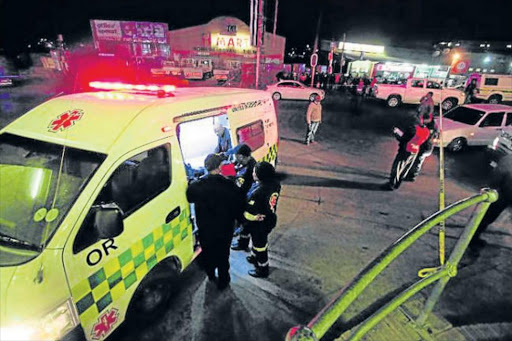 TRAGEDY: Emergency personnel respond to an incident of taxi violence in Mthatha on September 22 last year Picture: FILE