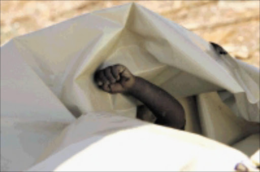 QUICK ACTION: Police acted fast to find two-year-old Tebogo Tshabalala's body in a pit toilet near his home. Pic. Antonio Muchave. 14/09/08. © Sowetan.