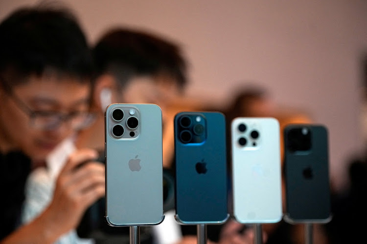 People look at the new iPhone 15 Pro as Apple's new iPhone 15 officially goes on sale across China at an Apple store in Shanghai, China, in this file photograph. Picture: REUTERS/ALY SONG