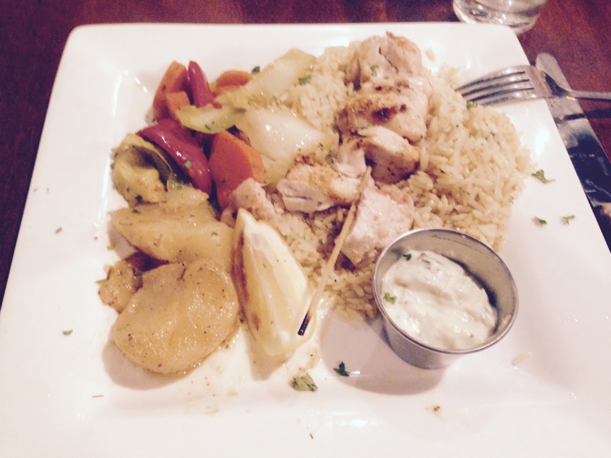 Chicken Souvlaki with Rice, Potatoes and Sautéed Vegetables. Served with Tatziki Sauce and Greek Sal