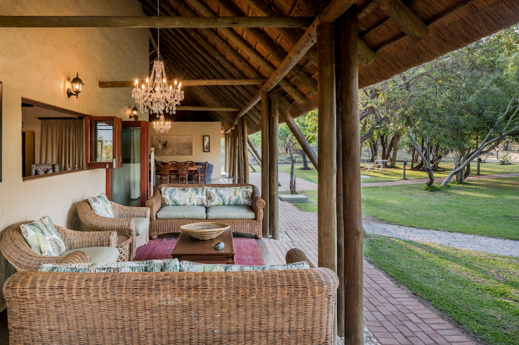 Deep couches on the shaded patio invite long, lazy afternoons at Tintswalo Manor House.