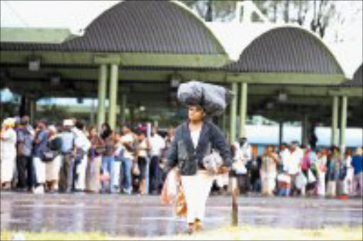 WEART TRAVELLERS: Durban commuters are caught in the middle of strike by bus drivers who are demading thier divided as BEE shareholders in a bus company. Pic. Mandla Mkhize. 30/01/2007. © Sowetan.