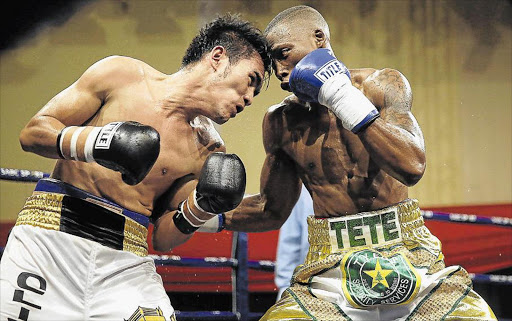 TETE ON TOP: Jether Oliva, left, and Zolani Tete square off at the Orient Theatre on Friday evening Pictures: MARK ANDREWS