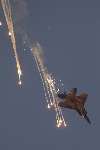 An Israeli F-15 fighter jet launches anti-missile flares during an air show in this file photo.