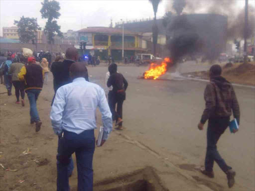 A bonfire lit by Wakulima Market traders during their demonstration against high rates by the Nairobi county government, July 12, 2018. /LEWIS NYAUNDI