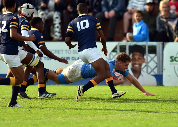 Grey High hooker Jon Hobson dives over for one of his four tries against Graeme College on the second and final day of the Grey High Rugby Festival on the Kolisi Field on Saturday. Grey won 29-7
