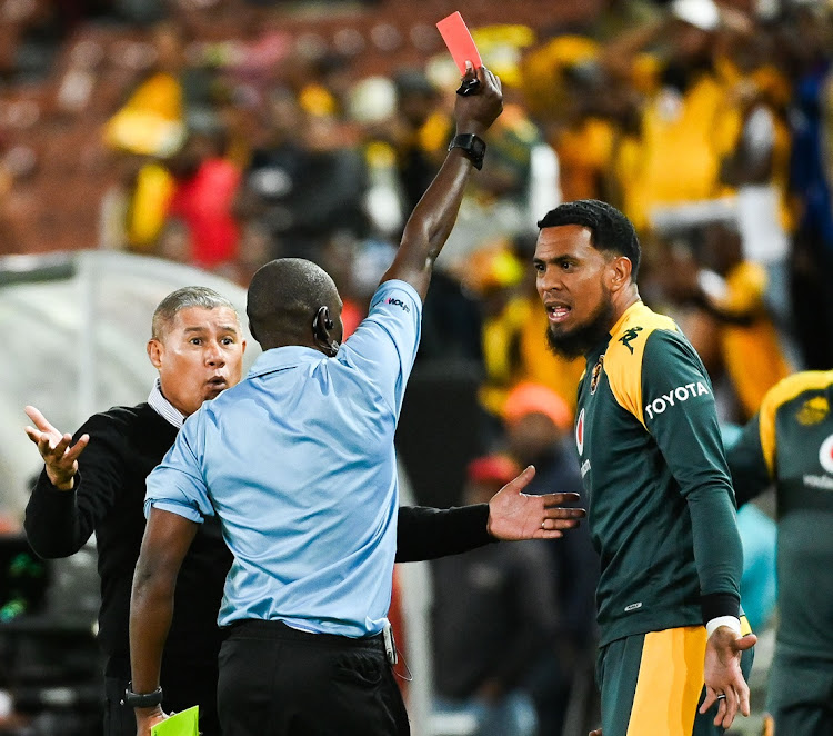 Kaizer Chiefs reserve goalkeeper Brandon Petersen receives a red card from referee Cedric Muvhali while coach Cavin Johnson protests in the DStv Premiership match against TS Galaxy at Peter Mokaba Stadium in Polokwane on Tuesday night.