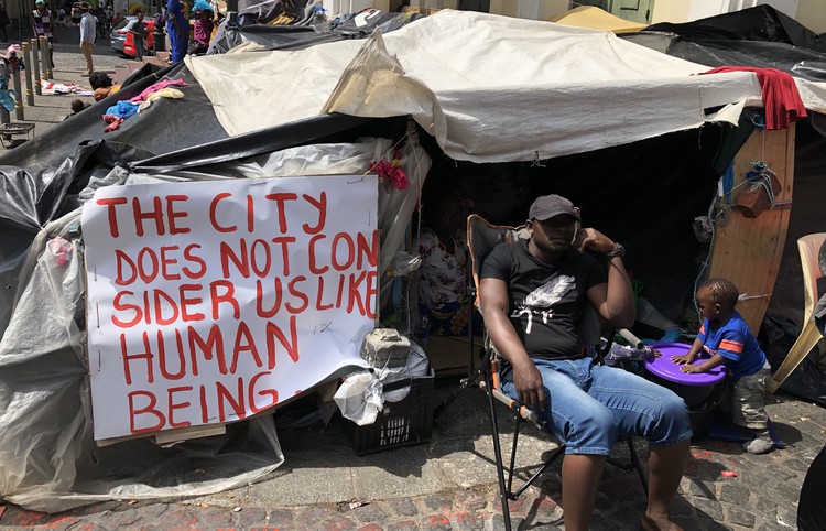Refugees living outside a church on Greenmarket Square in Cape Town are demanding resettlement.