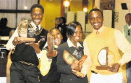 WINNERS: Sizwe Mlotshwa, Sindi Koloti, Nomasonto Radebe and Philani Sibisi scooped awards at the Gauteng Education Enrichment Awards in sports and culture on Friday. Pic. Bafana Mahlangu. 26/10/2008. © Sowetan