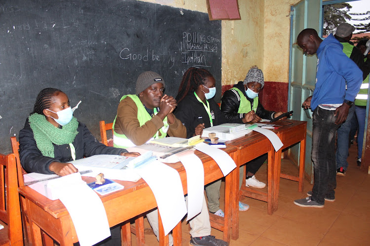 A voter getting served at Maragi primary school in Kiharu constituency, Murang'a County.