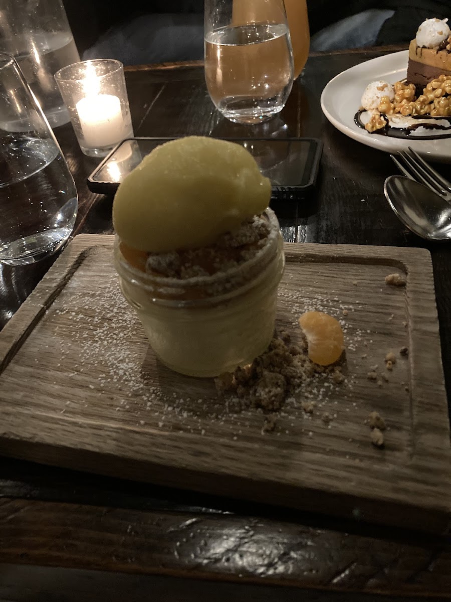 Goat cheese cheesecake w/ brown butter crumble and passion fruit sorbet