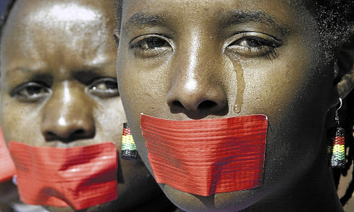In this image, Nomsa Dladla and Dudu Muvhali had joined a protest to highlight how the justice system is failing rape victims. The writer of this column states that in this country, rapists are given the benefit of the doubt and the victim has to prove that she was violated.