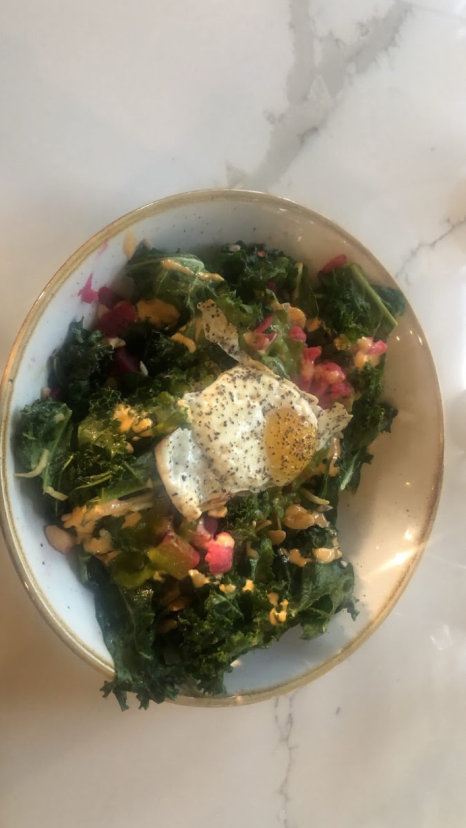 So Cal Grain bowl, It's a So-Cal Grain salad It's steamed kale, quinoa, picked veg (the veg that was available the day i went was cauliflower and beets) a sunny side up egg, cashews, chimmicurri and some be sort of fancy aïoli And sunflower seeds