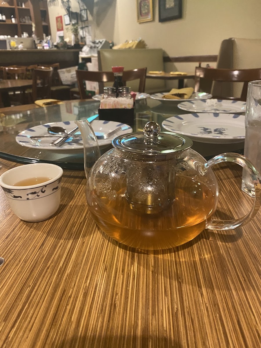 Jasmine hot tea served in glass tea pot