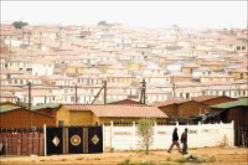 HOME SWEET HOME: The National Housing Finance Corporation and Absa are committed to build 100 000 houses for low-income earners before 2010. Pic. Marianne Schwankhart. 26/11/07. © Sunday Times.