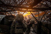 Soldiers fire a mortar at a frontline position in the Donetsk region during Russia's ongoing attacks on Ukraine. File photo. 