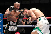 Moruti Mthalane forces Muhammad Waseem of Pakistan to cover up in their IBF World title clash  in Kuala Lumpur, Malaysia yesterday.