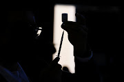 A health worker prepares a syringe with a dose of Covid-19 vaccine in Mexico City, Mexico. File photo.